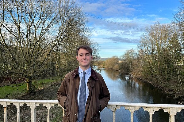 Cllr Glyn Preston on Llandinam Bridge in front of the River Severn