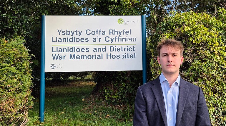 Glyn Preston standing outside Llanidloes Hospital