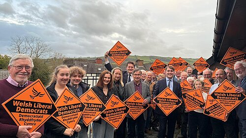 Photo of activists at the launch with Glyn in the centre and Lib Dem Diamonds